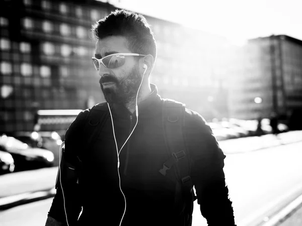 Handsome cyclist portrait wearing sunglasses black and white — Stock Photo, Image