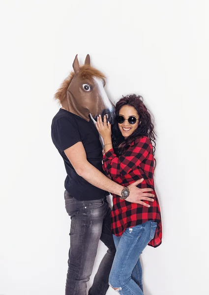 Pretty and happy girl portrait and her horse head boyfriend — Stock Photo, Image