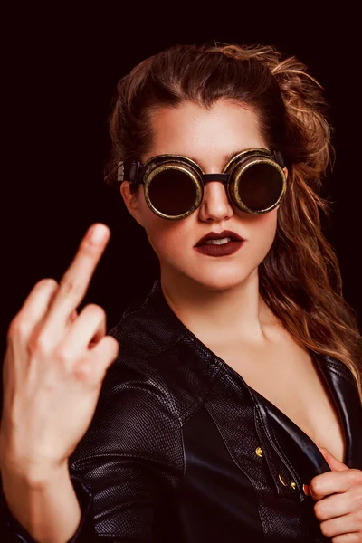 Beautiful and angry steampunk woman making middle finger — Stock Photo, Image