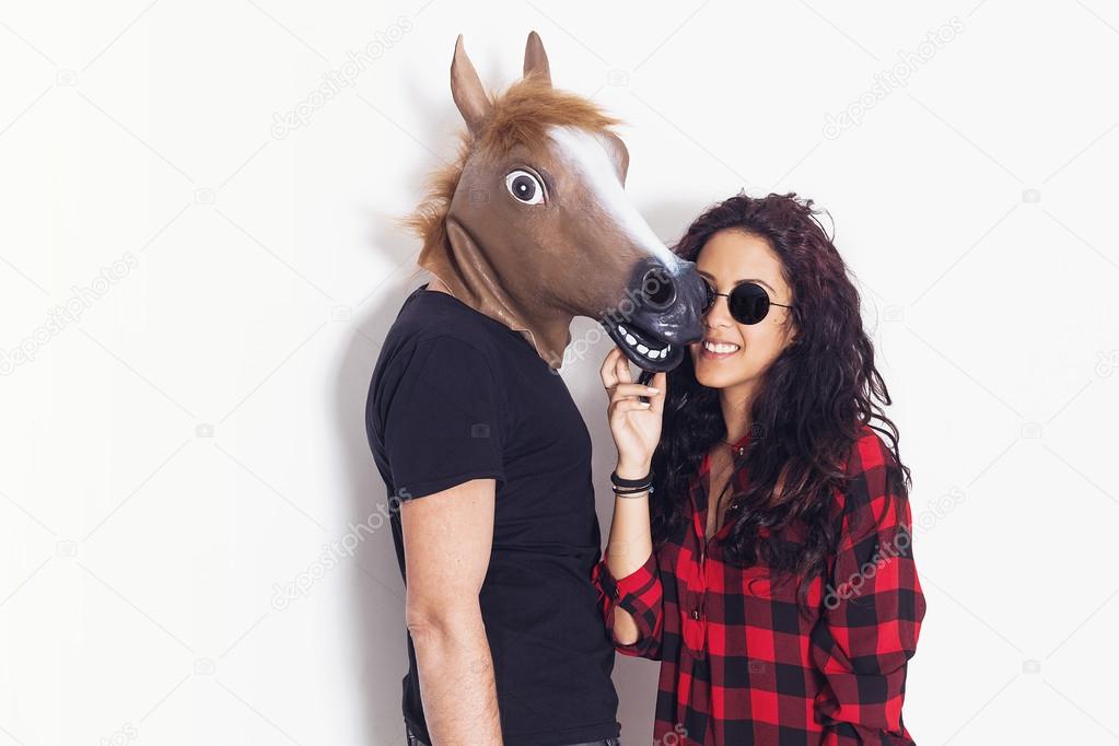 Pretty girl portrait and her horse head boyfriend