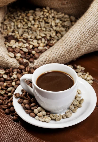 Coffee cup and jute sack full of coffee beans 7 — Stock Photo, Image