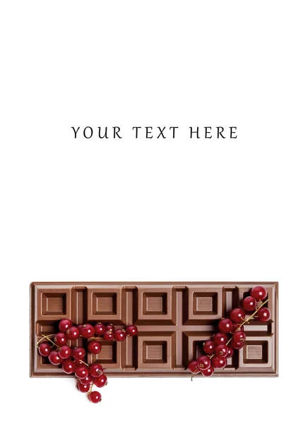 Chocolate bar with red currant blank space above — Stock Photo, Image