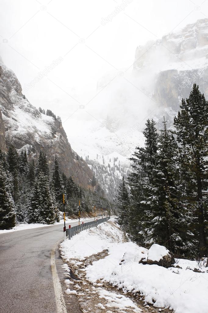 Driving in foggy and rainy winter landscape in Trentino