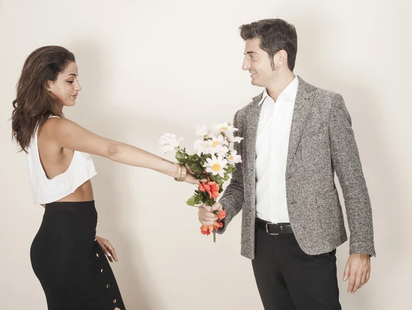 Woman accepting a bouquet from her date — Stock Photo, Image