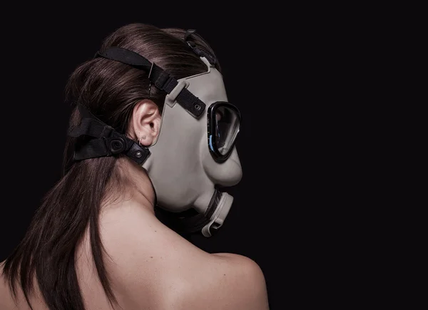 Girl wearing gas mask back — Stock Photo, Image