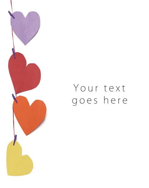 Vertikala hängde papper hjärtan gratulationskort — Stockfoto