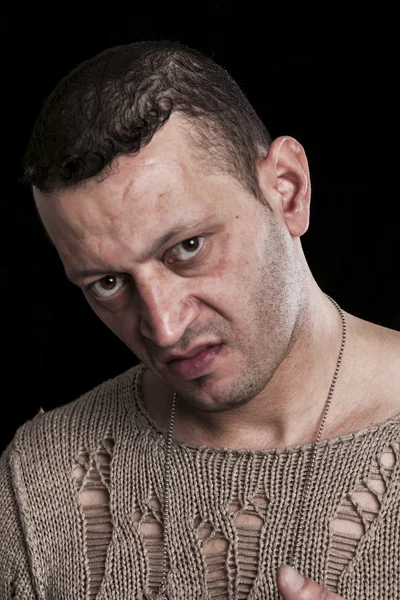 Frowning man portrait looking at camera on black closeup — Stock Photo, Image