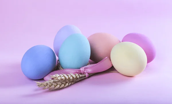 Colorful Easter eggs composition with sheaf of wheat — Stock Photo, Image