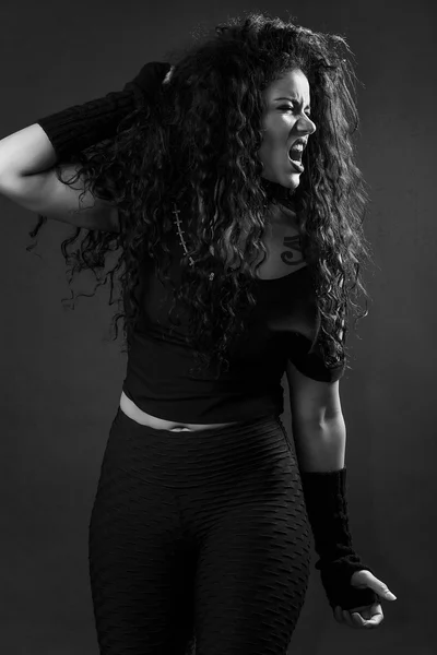Angry rocker girl screaming black and white — Stock Photo, Image