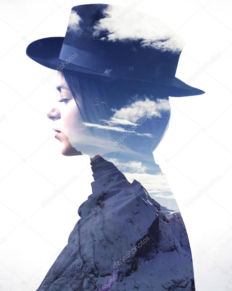Double exposure of girl wearing hat profile and mountains