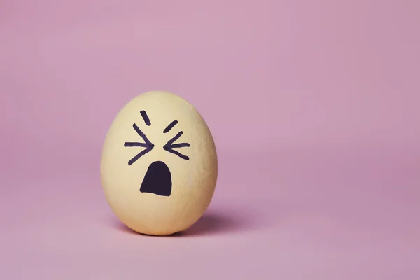 Weepy yellow painted egg — Stock Photo, Image