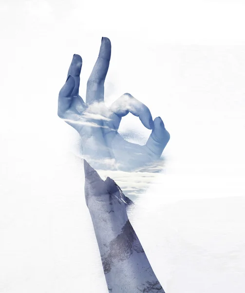 Double exposure of OK gesture and mountainscape — Stock Photo, Image