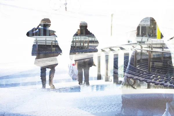 Double exposure of people walking and cityscape — Stock Photo, Image