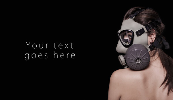 Beautiful girl wearing gas mask and looking aside card