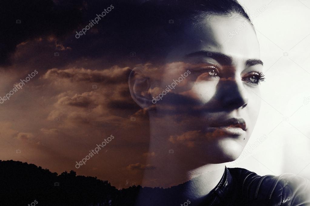 Double exposure of beautiful girl and red cloudscape