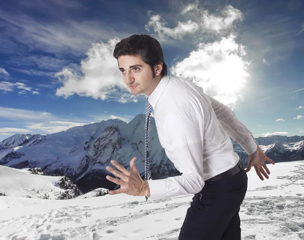 Determined businessman running towards mountain vacations — Stock Photo, Image
