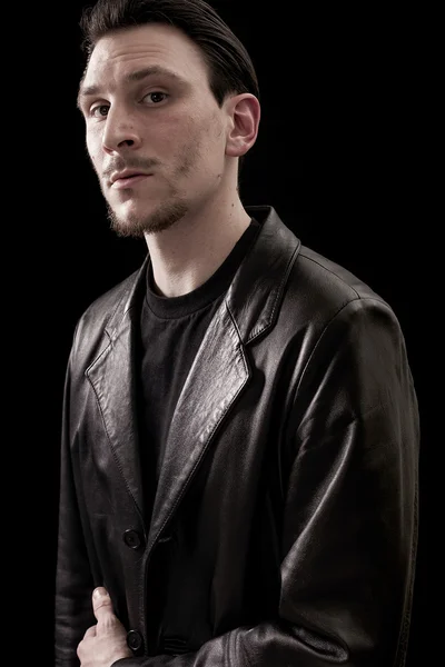 Male portrait wearing leather coat and looking — Stock Photo, Image