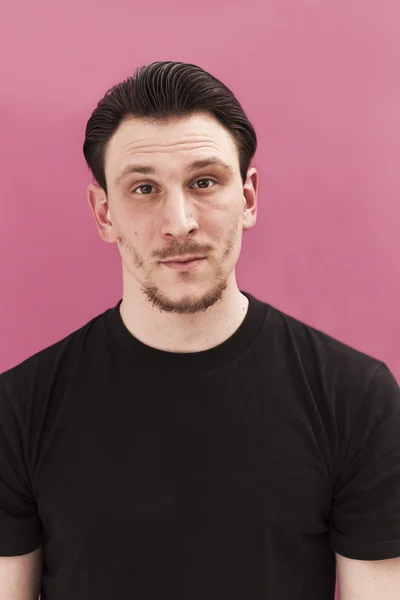 Handsome man portrait smiling on pink background — Stock Photo, Image