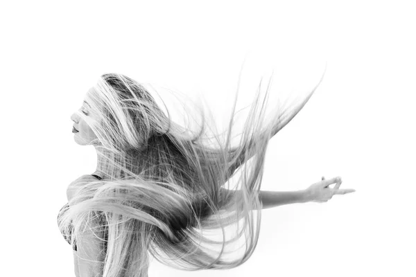 Cheerful girl dancing and throwing her hair black and white — Stock Photo, Image