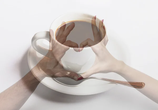Double exposure of heart hand gesture and cup of coffee — Stock Photo, Image