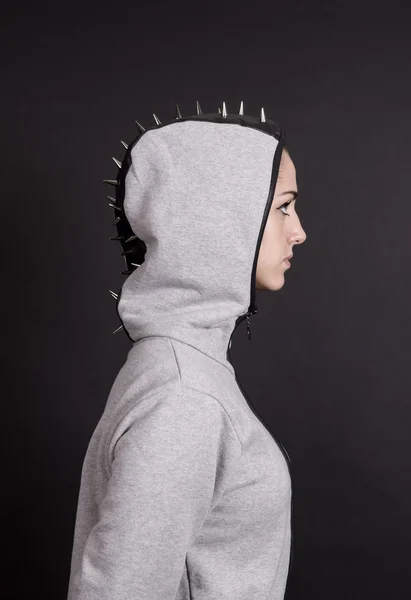 Girl profile portrait wearing hoodie with studs — Stock Photo, Image