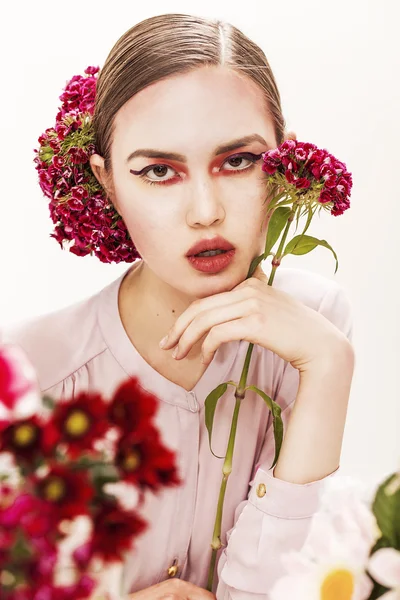 Gorgeous girl beauty portrait holding flower branch — Stock Photo, Image