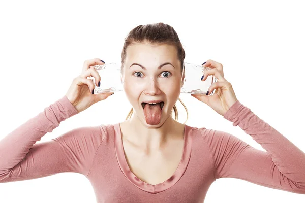 Crazy girl with glasses on ears and tongue stuck out — Stock Photo, Image