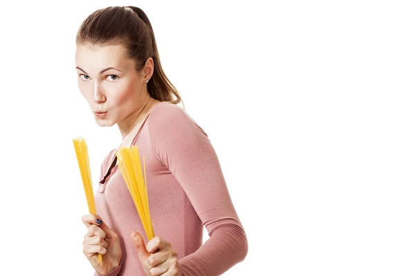 Beautiful and funny fighter girl holding bunch of spaghetti — Stock Photo, Image