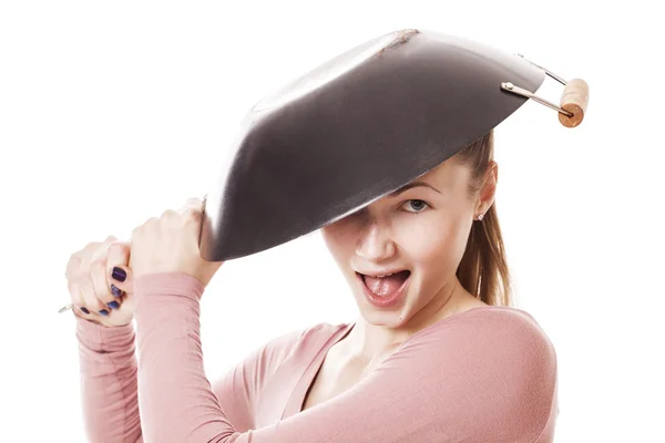Crazy and beautiful girl wearing frying pan as hat — Stock Photo, Image