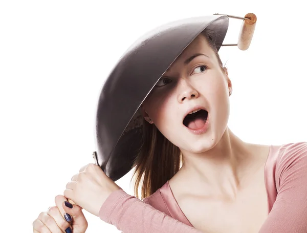 Crazy and funny girl wearing frying pan as hat — Stock Photo, Image