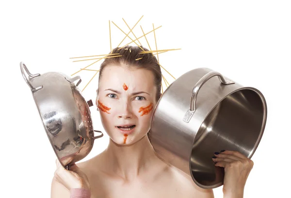 Crazy girl in the kitchen choosing from colander and pot — Stock Photo, Image