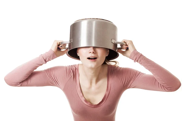 Funny girl portrait hiding her head under soup pot — Stock Photo, Image