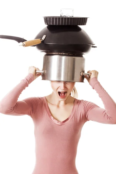 Screaming girl portrait holding on head pot and frying pans — Stock Photo, Image