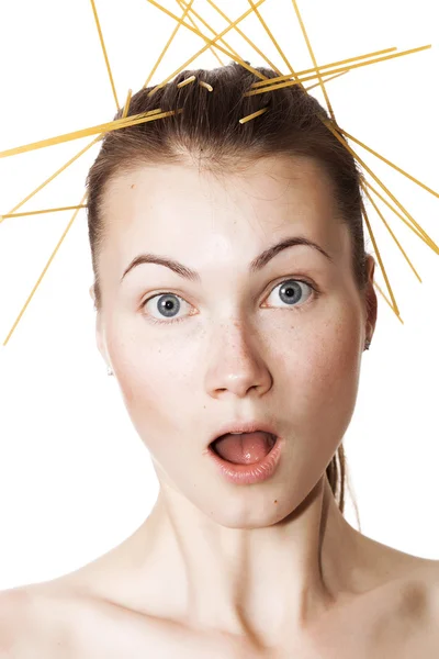 Surprised girl closeup portrait with spaghetti in the hair — Stock Photo, Image