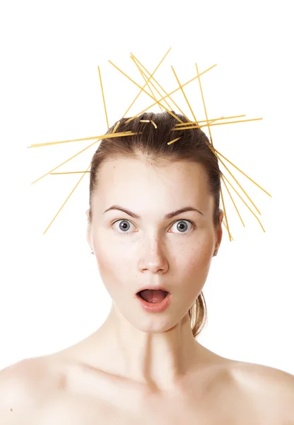 Surprised girl portrait with spaghetti in the hair — Stock Photo, Image