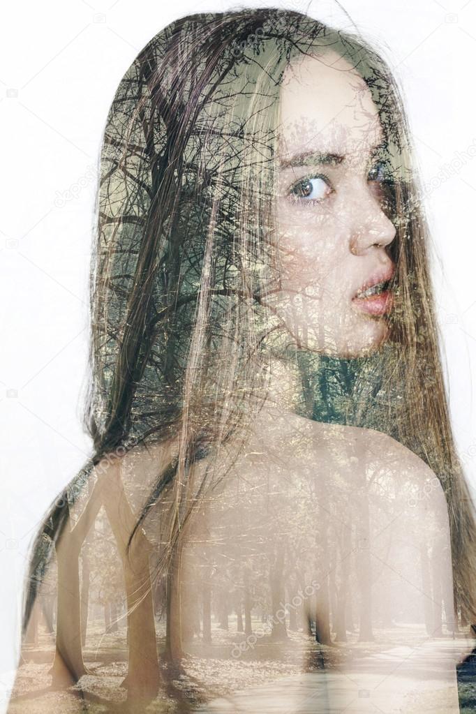 Double exposure of beautiful girl and winter trees