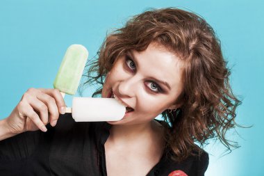 Beautiful girl portrait tasting lemon popsicle