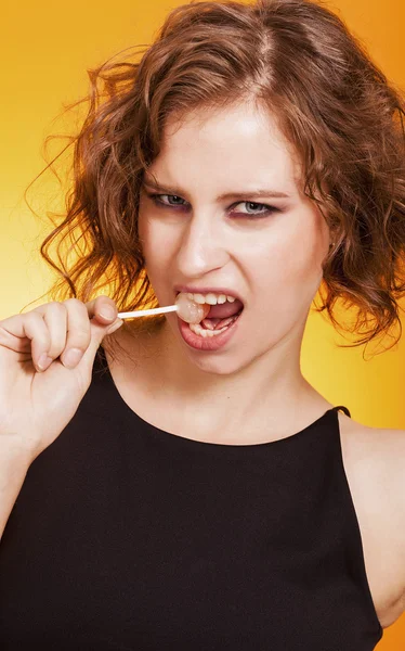 Sexy girl closeup portrait eating a lollipop — Stock Photo, Image