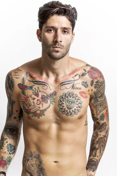 Handsome and sexy tattooed man looking at camera — Stock Photo, Image