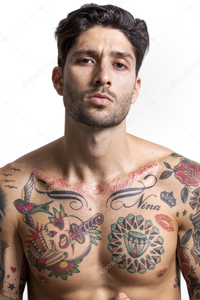 Sexy tattooed man portrait looking