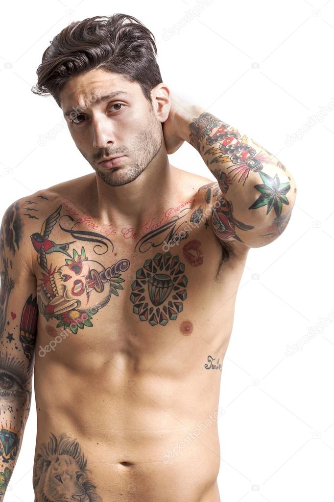 Handsome tattooed man looking at camera