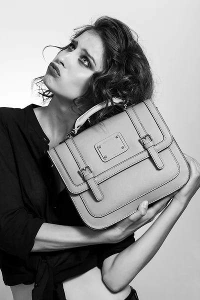 Beautiful girl portrait holding a bag black and white — Stock Photo, Image