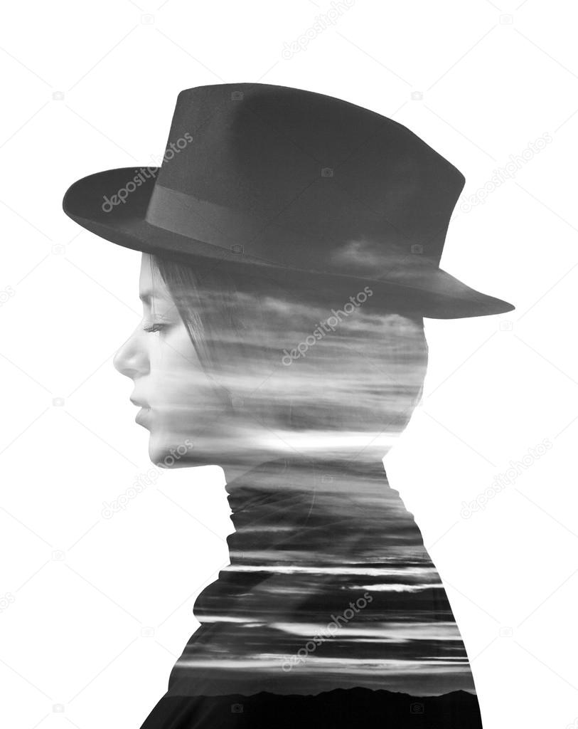 Double exposure of girl wearing hat and sunset monochrome