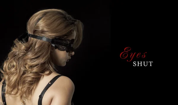 Blindfold woman portrait on black — Stock Photo, Image