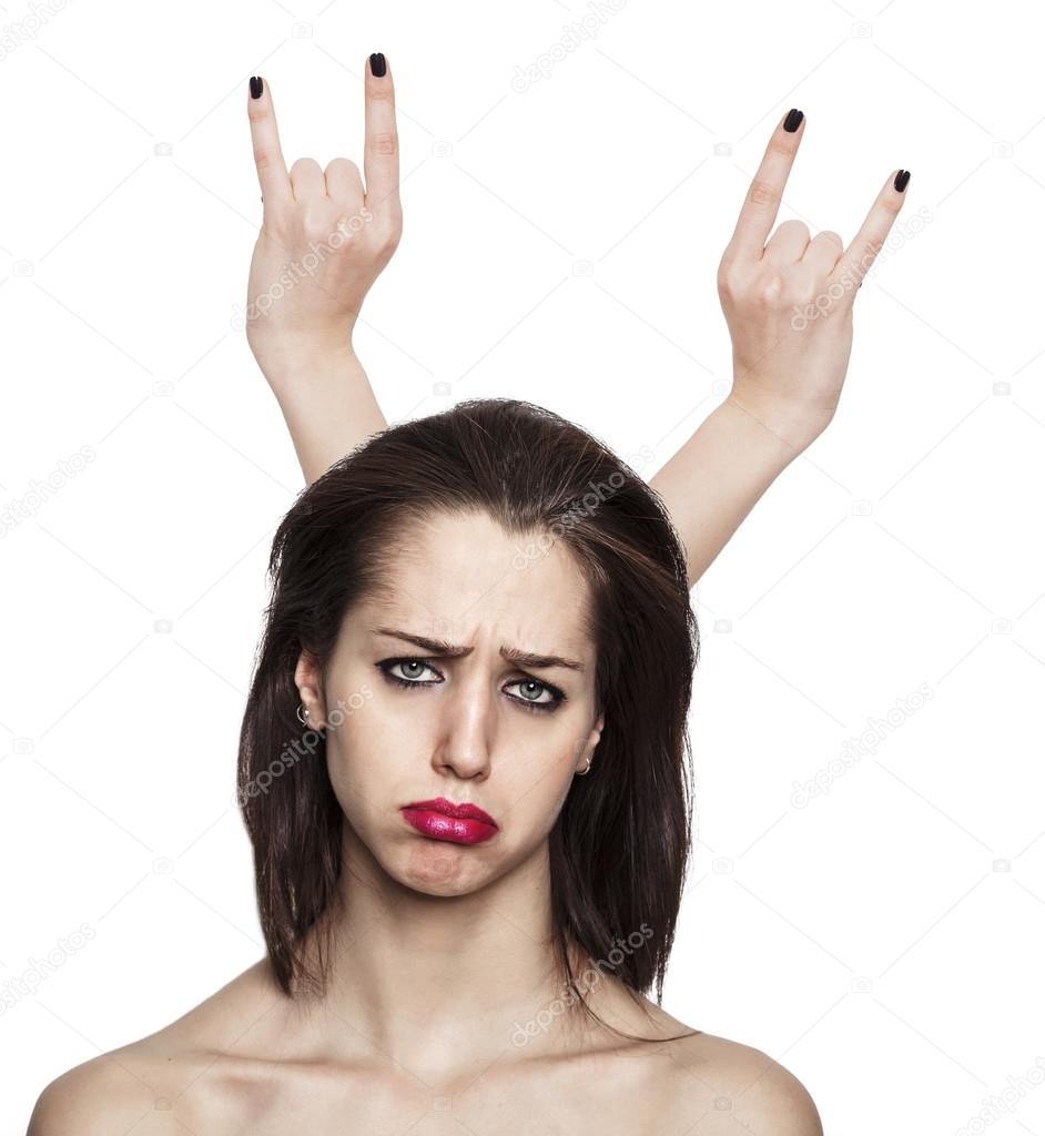 Sad girl portrait with hand horns