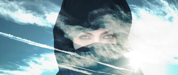 Double exposure of woman wearing burqa and cloudscape letterbox — Stock Photo, Image