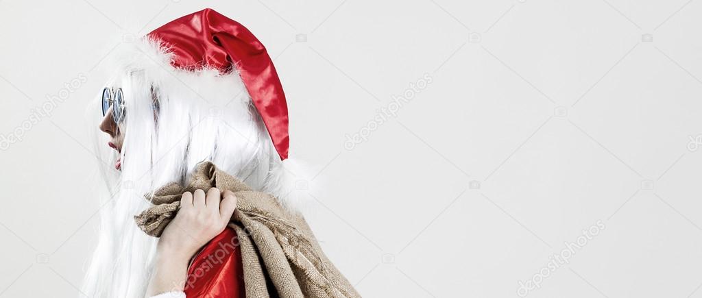 Santa Claus holding jute sack and going to work letterbox