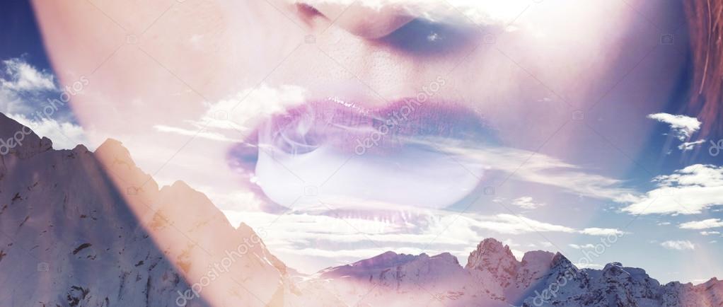 Double exposure of woman mouth smoking and mountainscape letterb