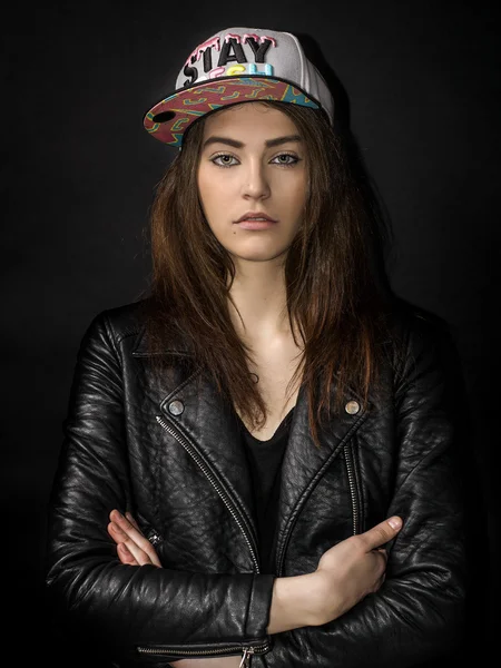 Beautiful girl portrait wearing basket cap and leather jacket — Stock Photo, Image