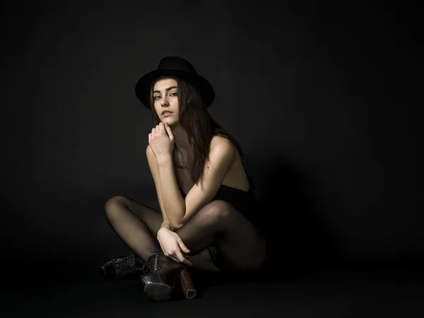 Beautiful rocker girl portrait wearing hat and looking — Stock Photo, Image